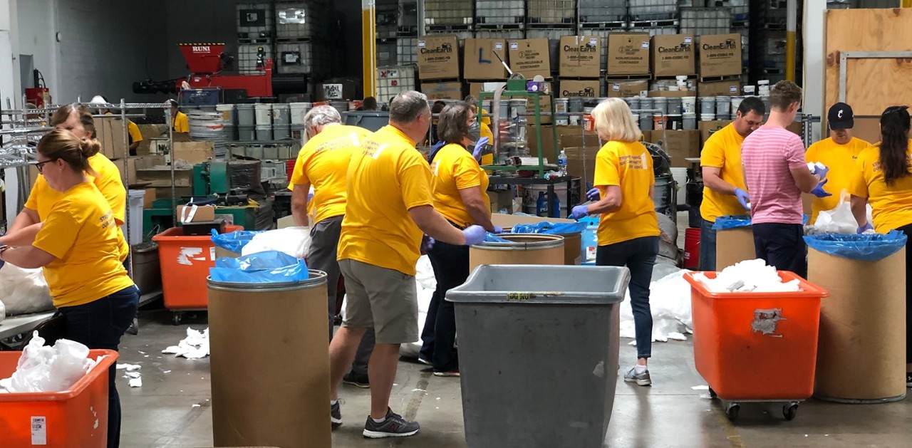 First Financial Bank associates volunteering at a warehouse and organizing goods