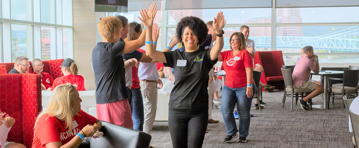 First Financial Bank employees cheering at company event