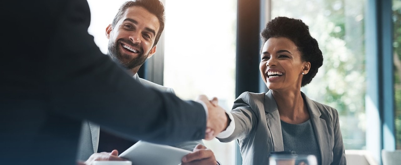 Business owners shaking hands with investor