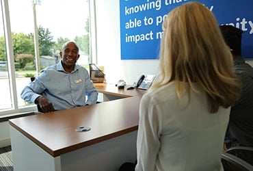 African-American male First Financial relationship manager meeting with young couple