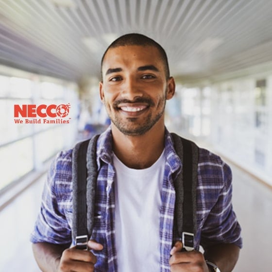 Young Hispanic man holding backpack, with Necco logo