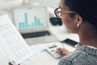 Female business owner reviewing financial documents