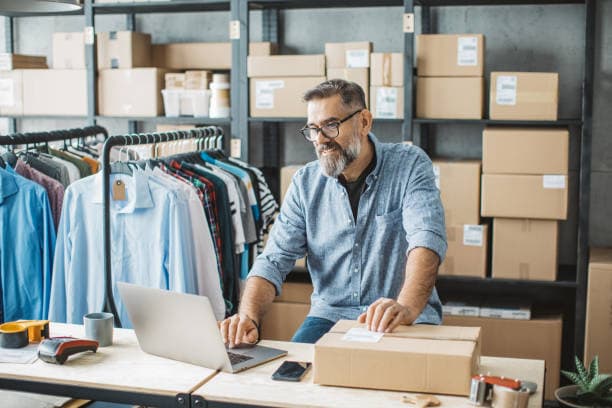 Small business owner packs up an online order