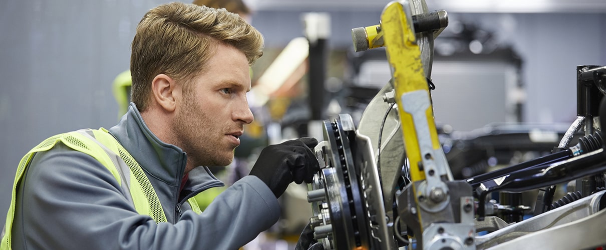 Factory worker using precision machine