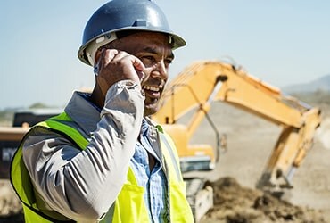 Construction foreman on a phone call