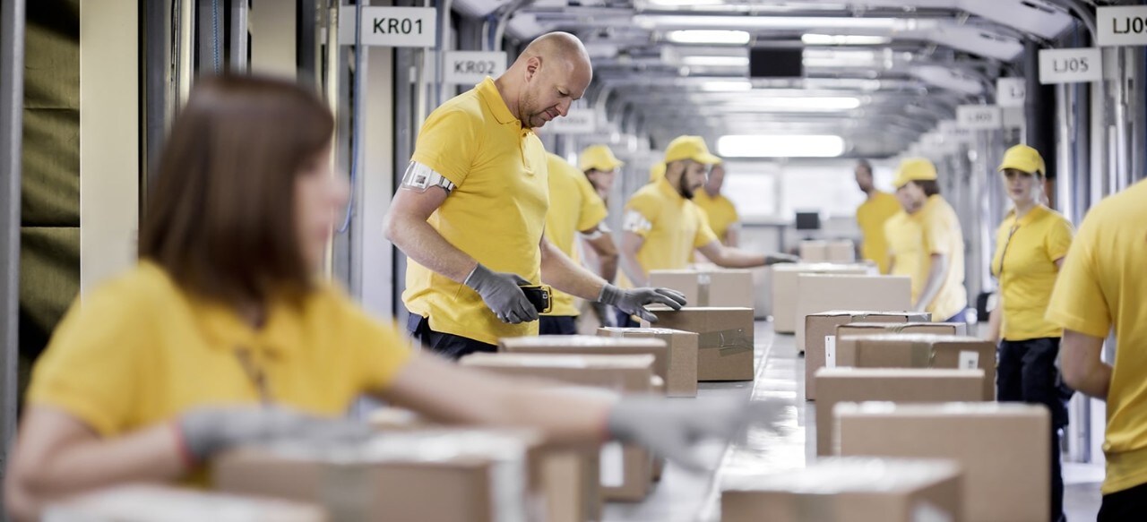 Workers at shipping facility assembly line