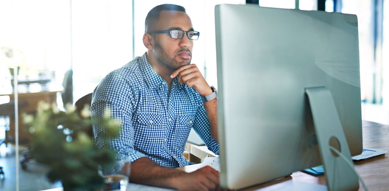 African-American businessman working at computer