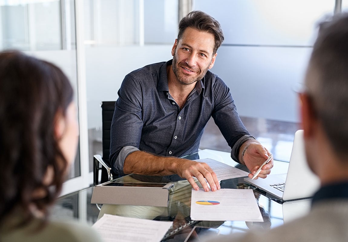 Banker reviewing financial data with clients