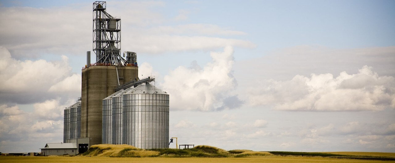 Grain elevator in open farm field