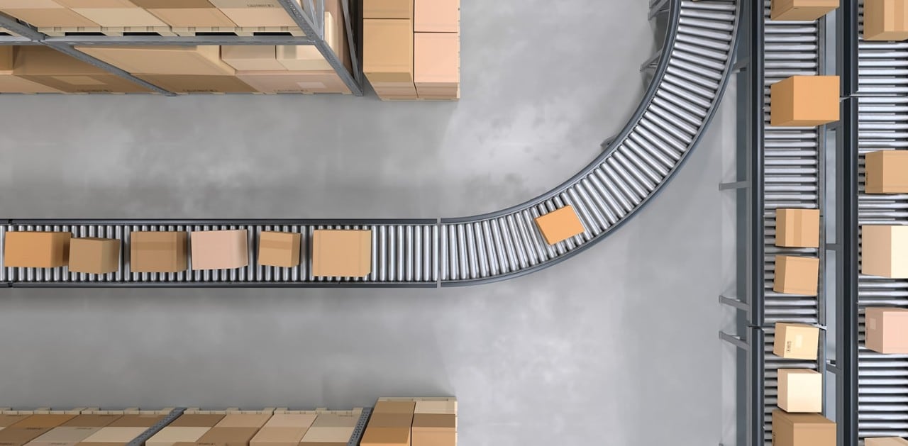 Shipping boxes on a conveyor belt in a warehouse