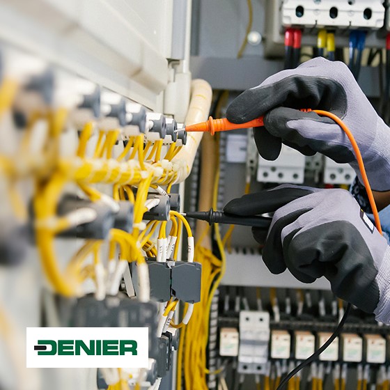 Technician working on electrical equipment, with Denier logo
