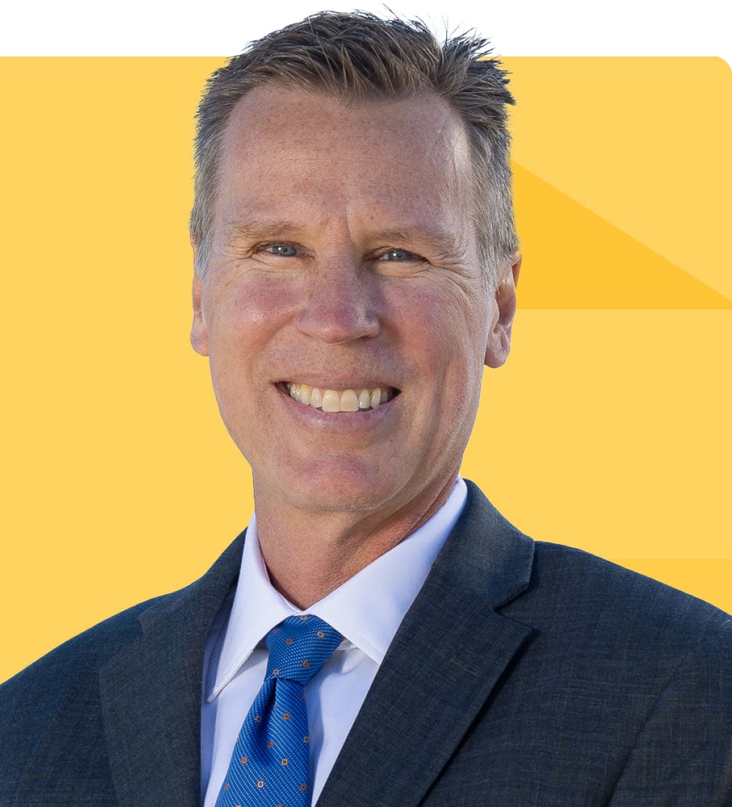 Headshot of David Dannemiller on a gold tessellated background