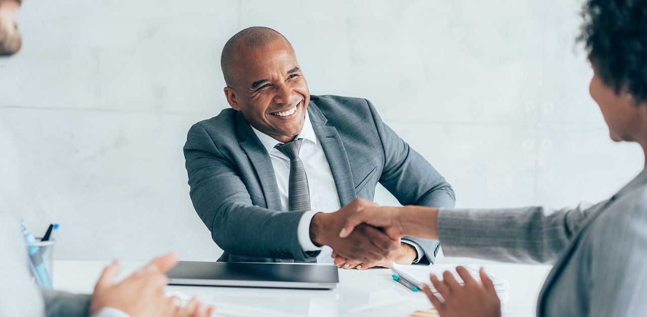 Business owner shaking hands with lending officer