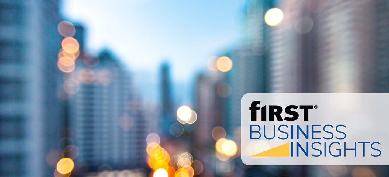 First Business Insights logo over image of city skyline