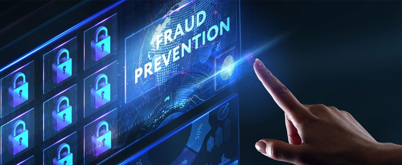 A woman's hand touching a digital display with the phrase "Fraud prevention" and padlock icons