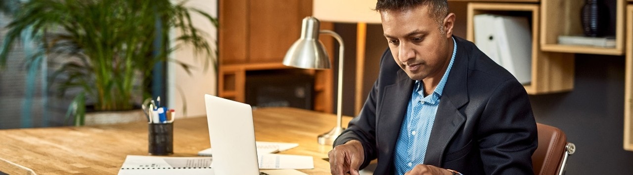 Business owner reviewing finances at desk