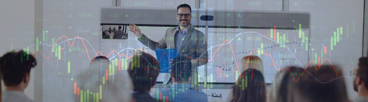Smiling man giving a business presentation with overlay of graphic displaying financial data