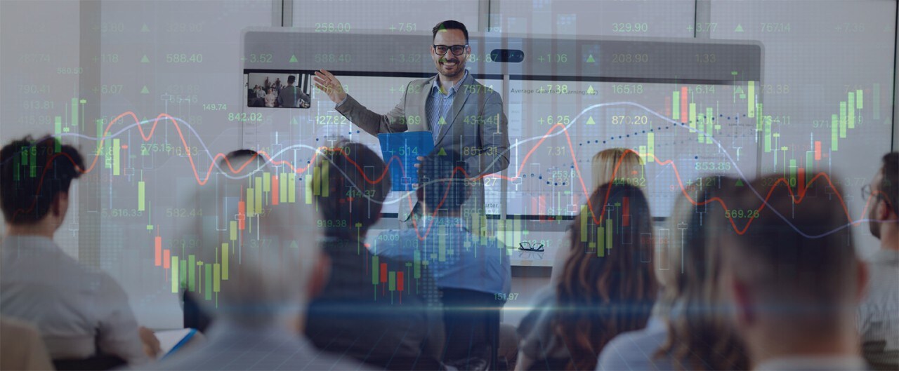 Smiling man giving a business presentation with overlay of graphic displaying financial data
