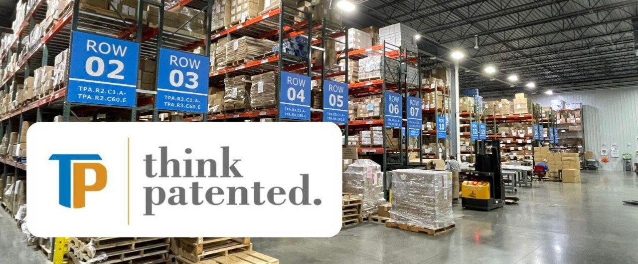Interior of a fulfillment warehouse with logo overlay reading "Think Patented"