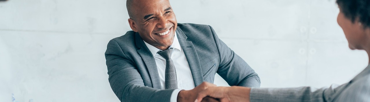 Business owner shaking hands with lending officer