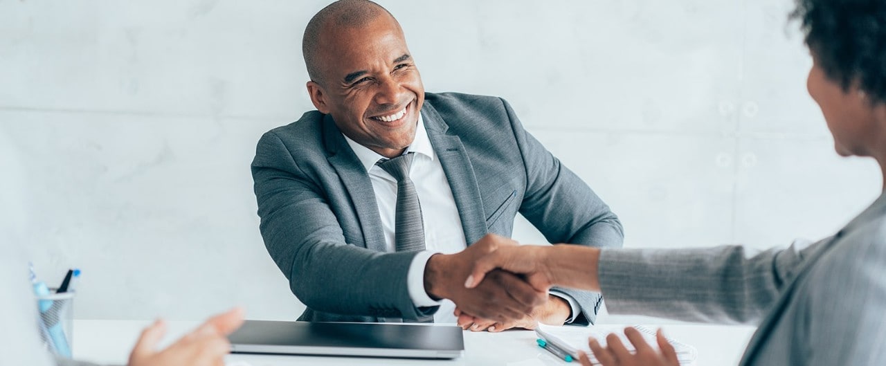 Business owner shaking hands with lending officer