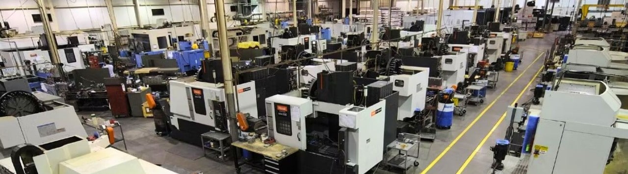 Wide view of manufacturing plant with rows of machines