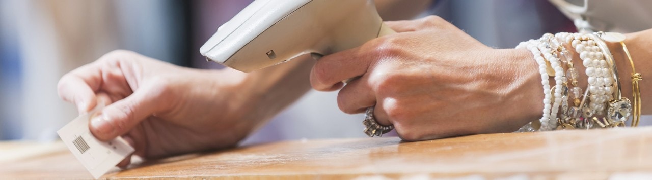 Sales clerk scanning a price tag