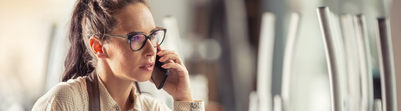 Worried restaurant owner talking on phone