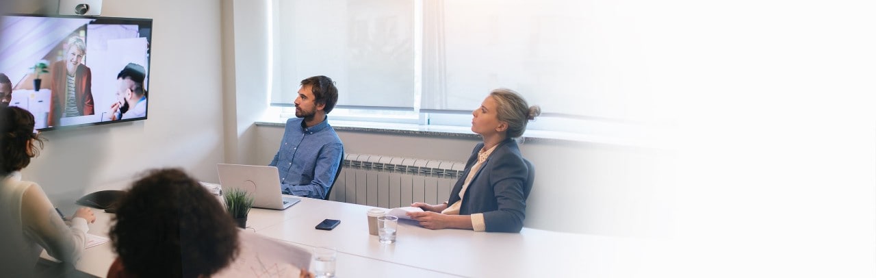 Group of young business people discussing with colleagues on video conference on meeting.