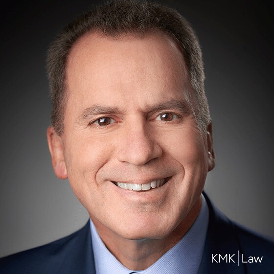 Alan Fershtman headshot with KMK Law logo