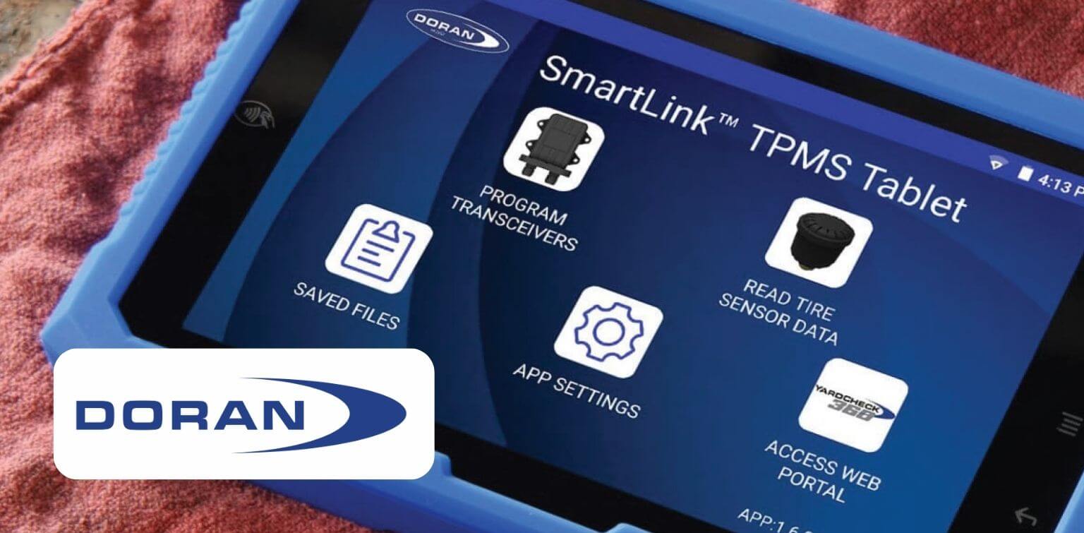 Blue tablet showing screen of tire pressure monitoring program. Overlay of logo for Doran Manufacturing.