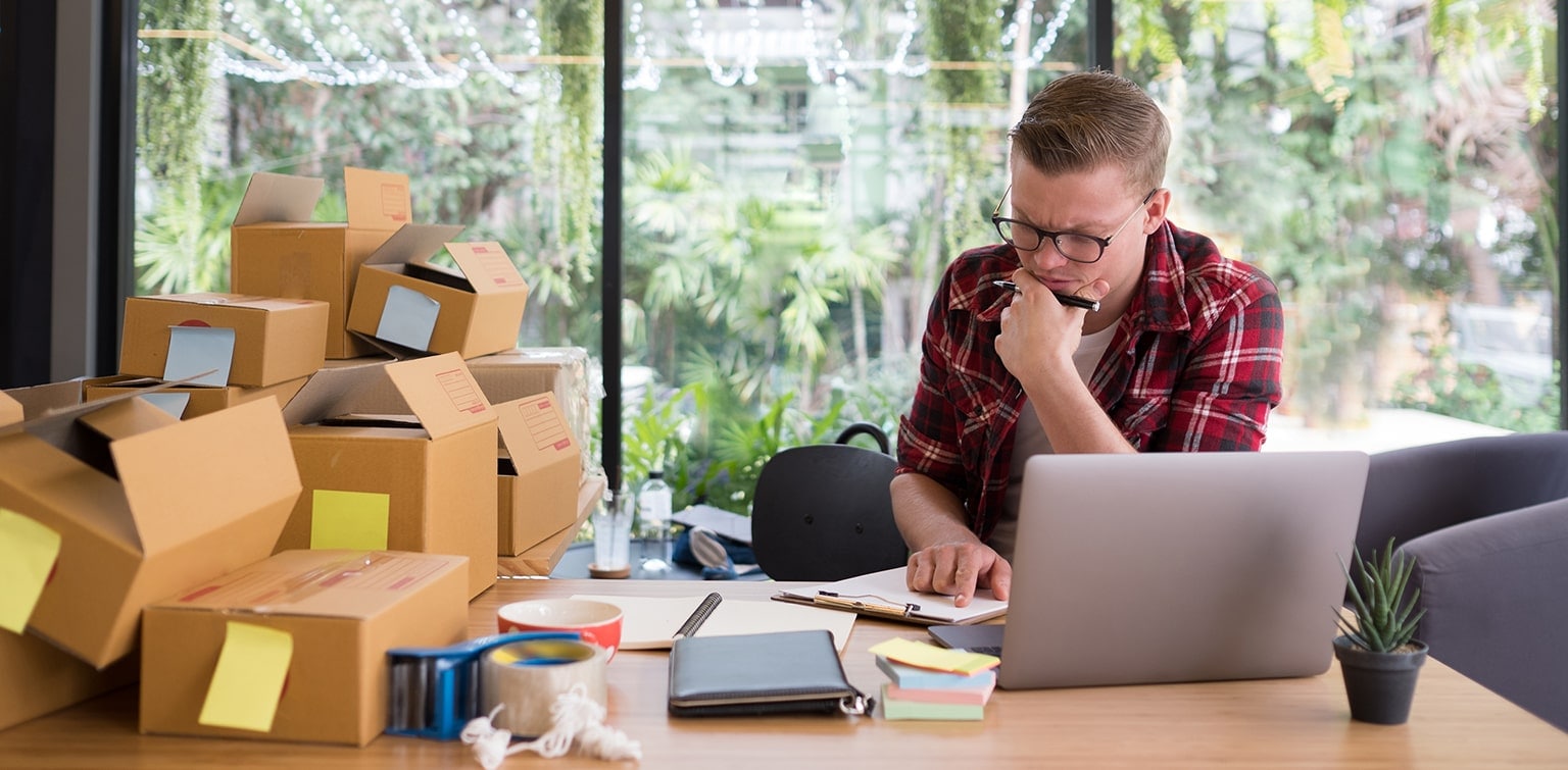 Stressed small business owner looking at computer