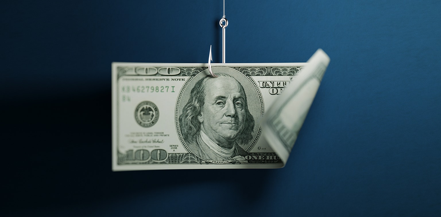 One hundred American dollar banknote on blue background. American dollar banknote is hooked by a fishing hook. Horizontal composition with selective focus and copy space. Great use for American dollar currency and financial concepts.