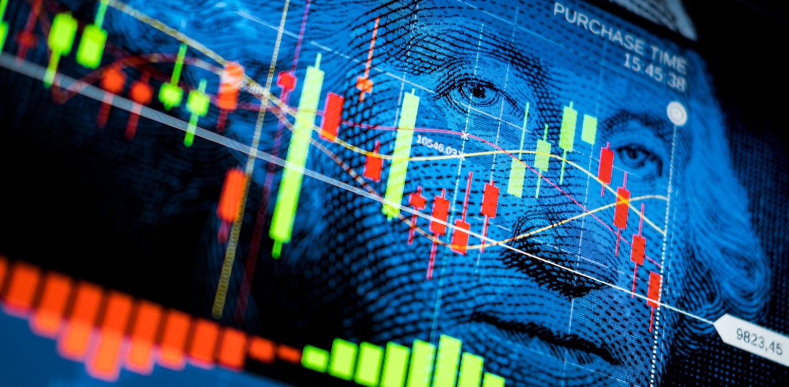 Red and green economic data points over close up image of Washington's portrait on $1 bill