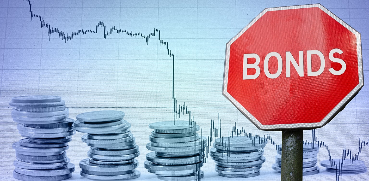 Stop sign labeled "Bonds" with coins and downward-trending graph in background