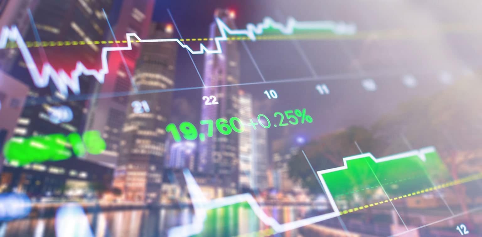 Economic data displayed digitally over a cityscape image