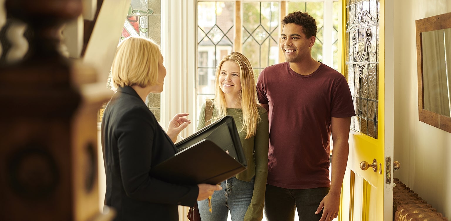 Realtor shows mixed race couple a home. 