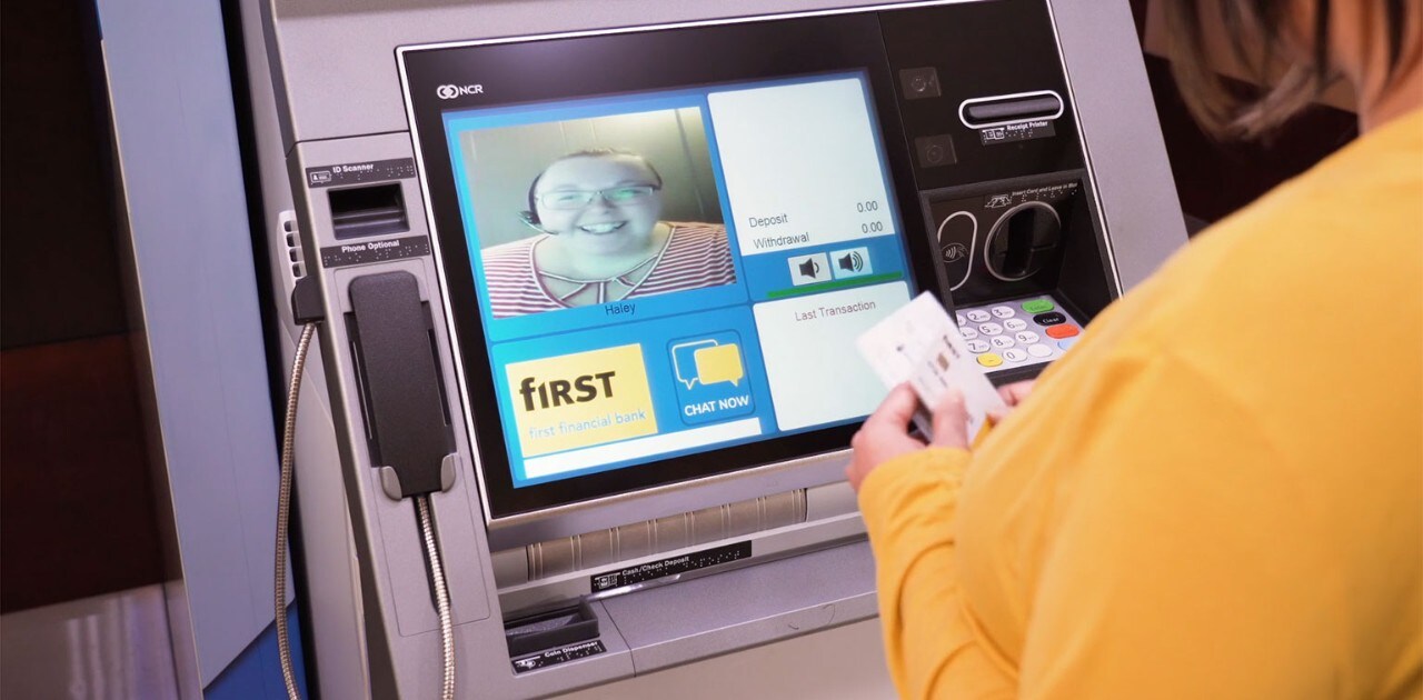 Client using a First Financial Bank Interactive Teller Machine (ITM) to deposit a check