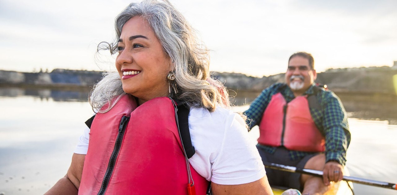Middle-aged Hispanic couple kayaking
