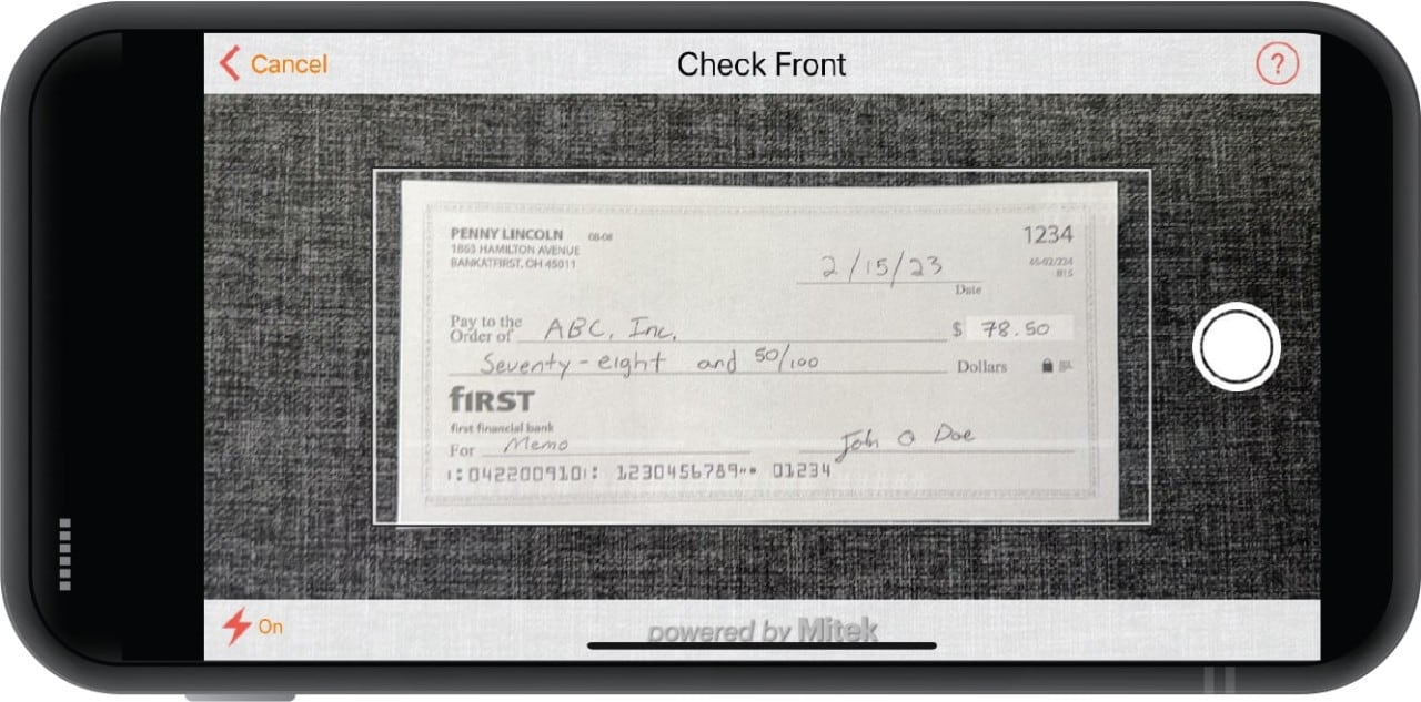 Smartphone camera taking photograph of check for mobile deposit