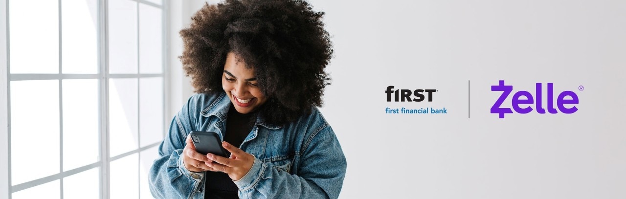 Smiling African-American woman using smartphone, next to First Financial Bank and Zelle® logos