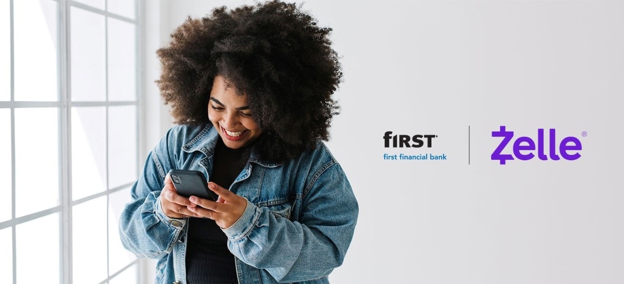 Smiling African-American woman using smartphone, next to First Financial Bank and Zelle® logos