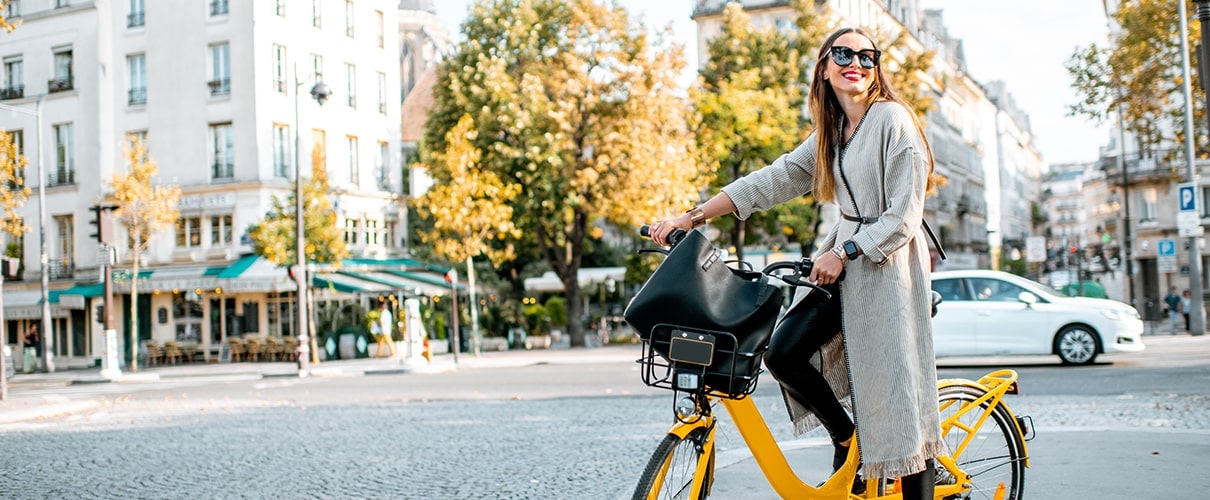 Woman on bicycle in downtown area