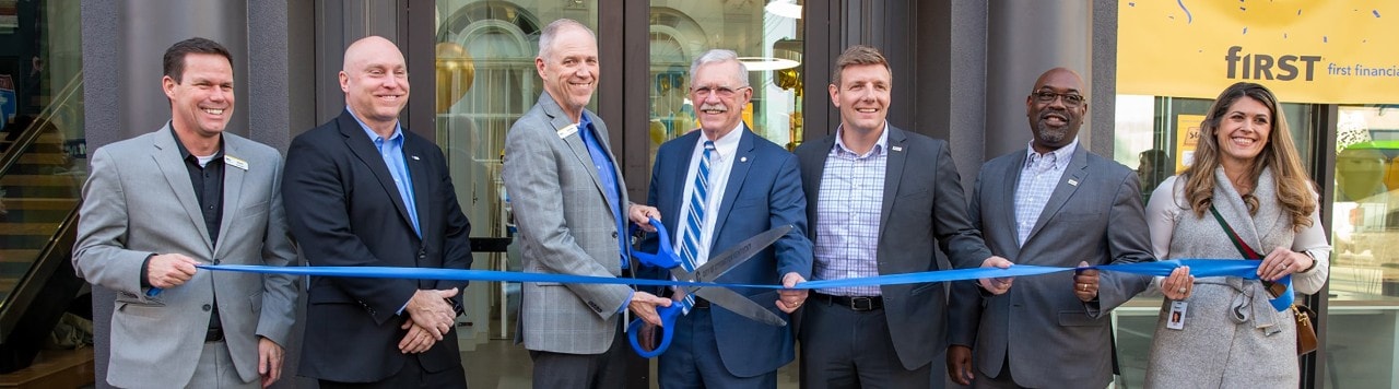 First Financial Bank executives and Covington officials participating in 6th & Madison ribbon-cutting