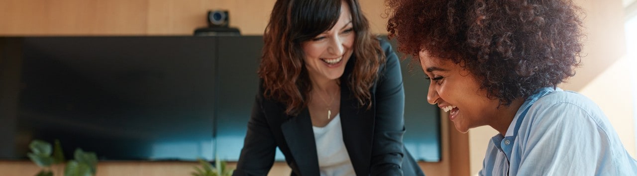 Two women laughing together