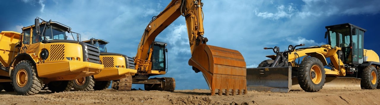 Construction equipment on a dirt field