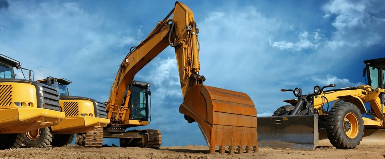 Construction equipment on a dirt field