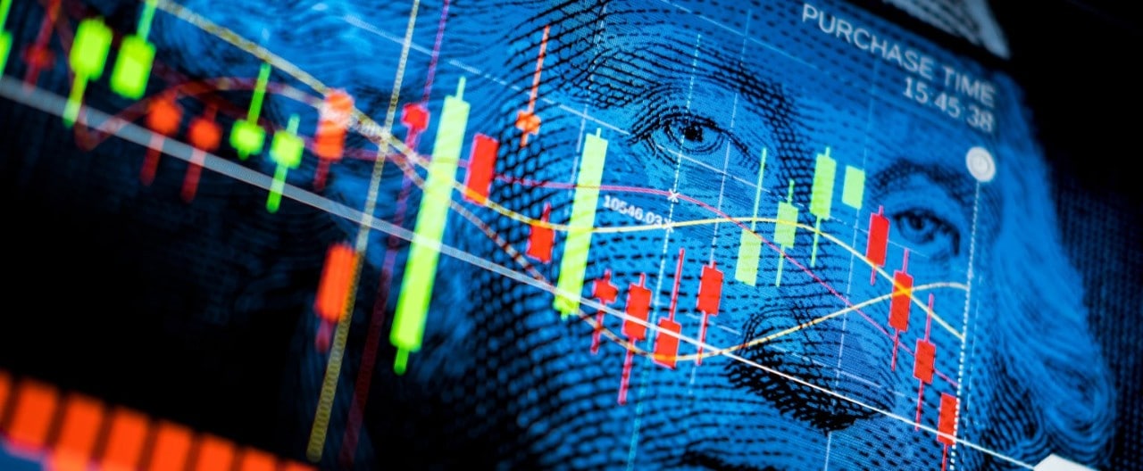 Red and green economic data points over close up image of Washington's portrait on $1 bill