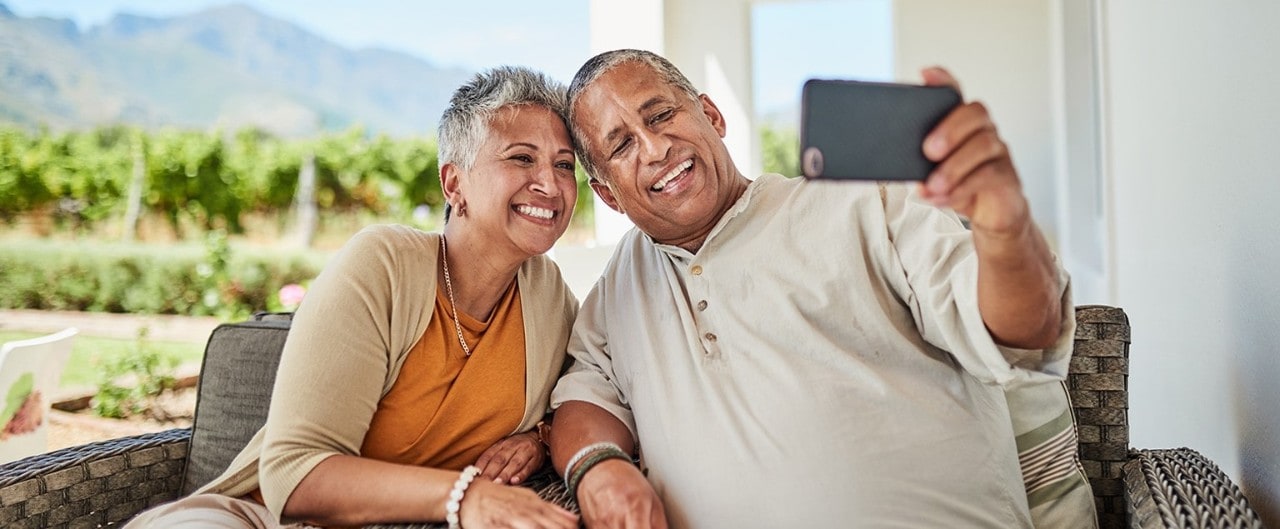 Smiling senior couple taking a selfie