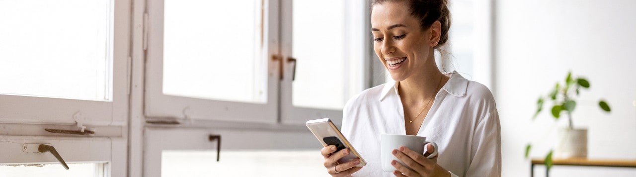 Shot of a young businesswoman using smartphone in an office